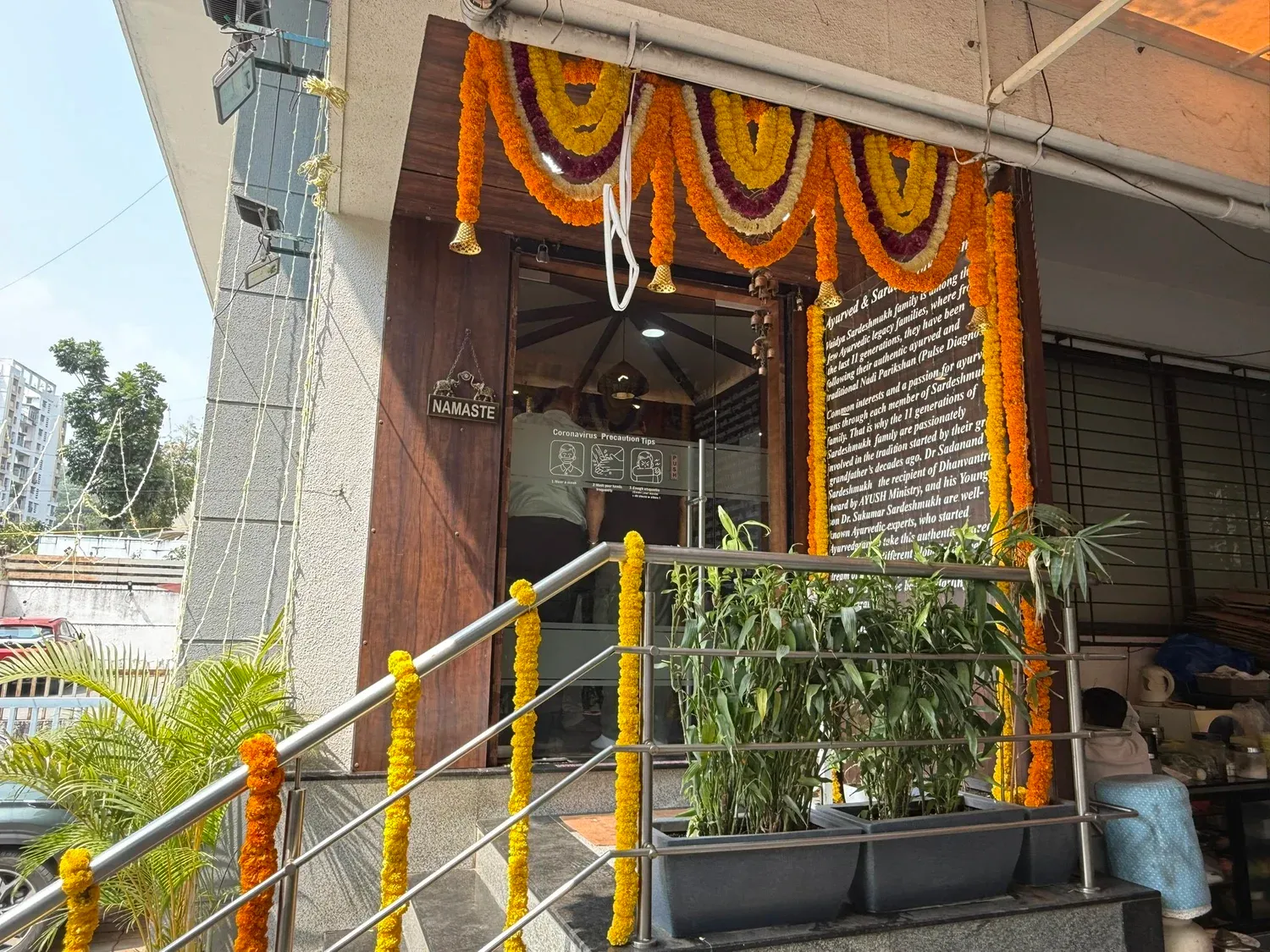 Entrance of the Ayurvedgram clinic in Pune decorated with marigold garlands