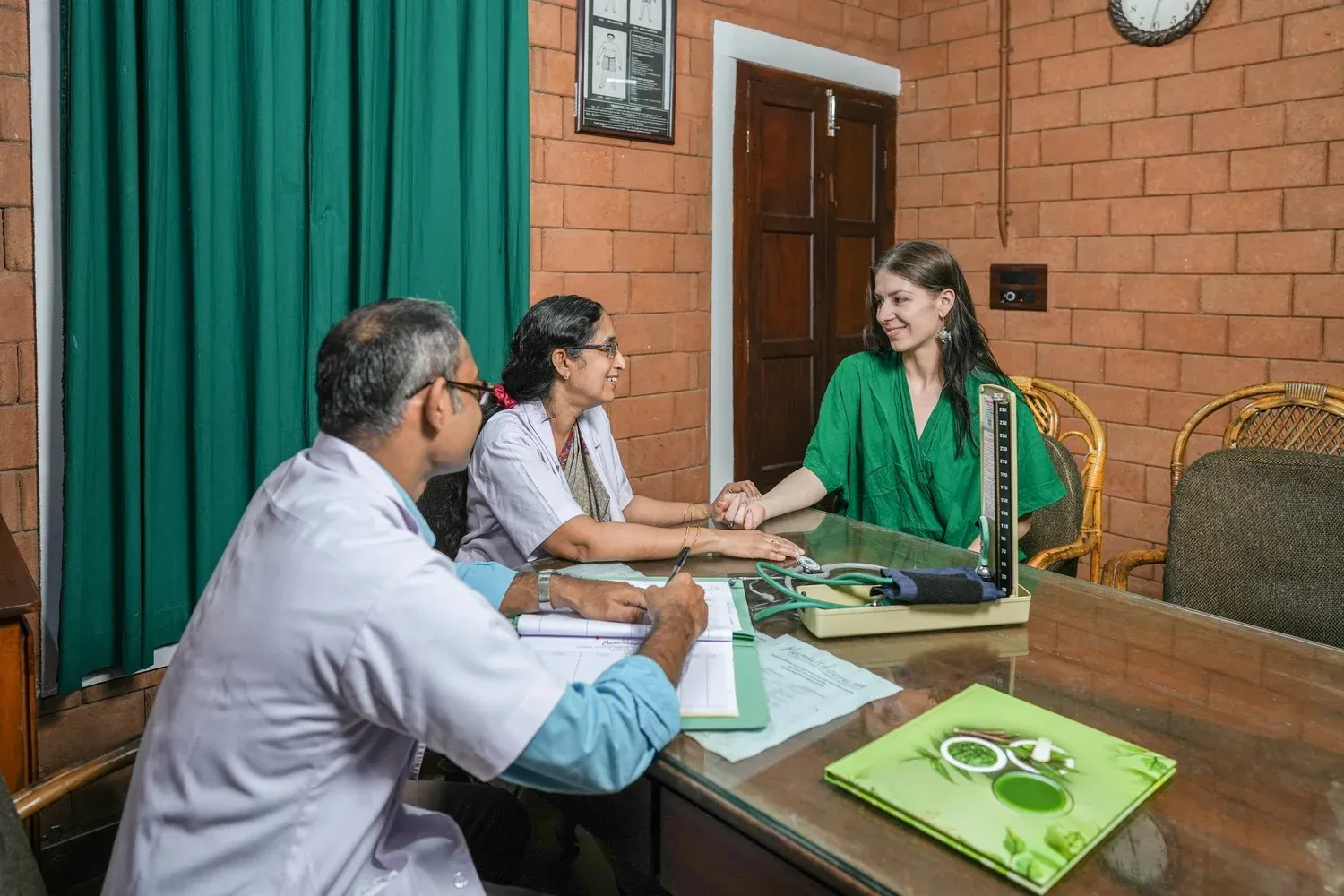 Ayurvedic doctor consulting with a guest