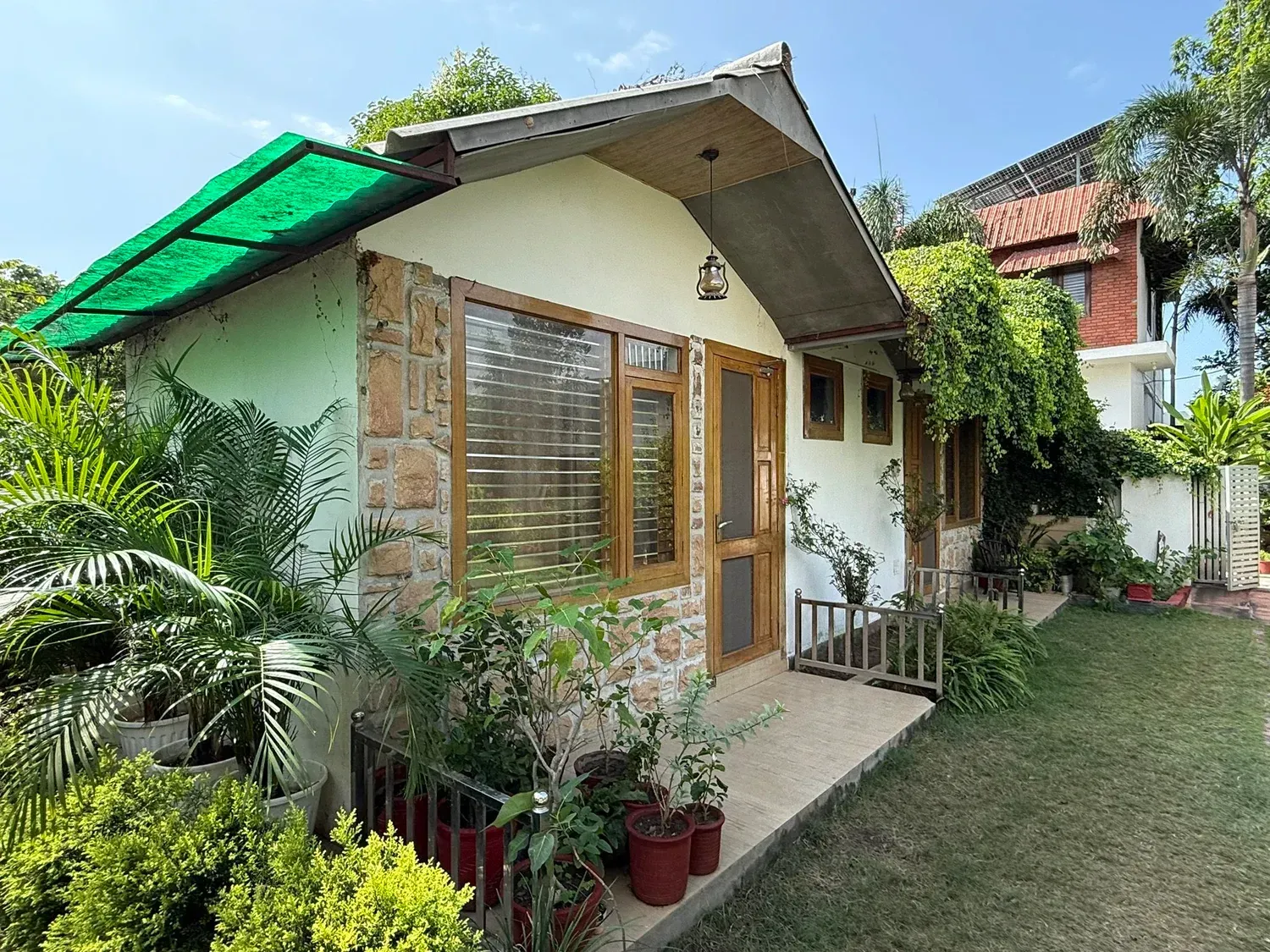 Inner garden and treatment building at Vedic Kaaya in Haridwar